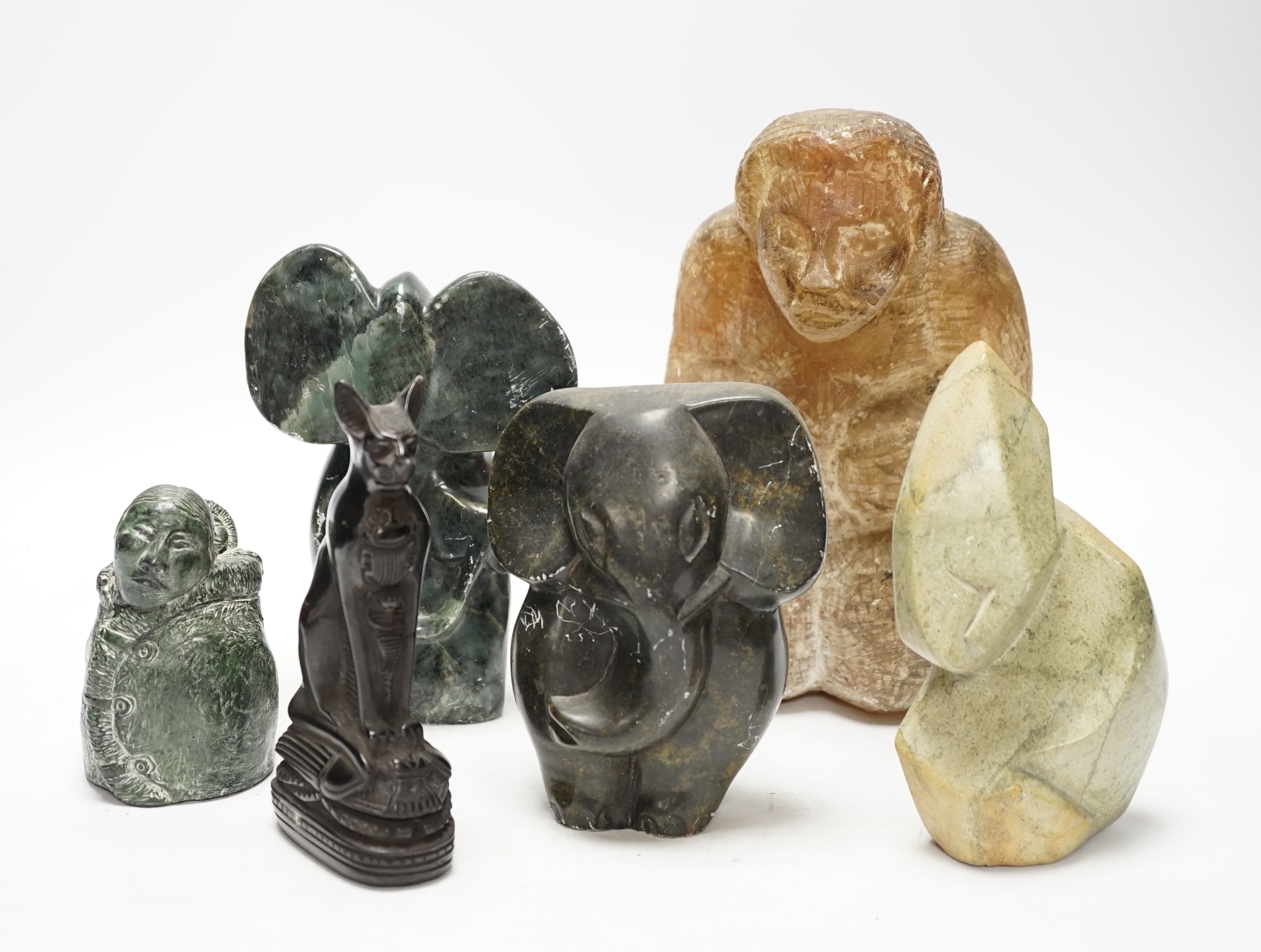 Six soapstone and marble carvings of Inuit figures, elephants, an Egyptian style cat, etc. tallest 22.5cm